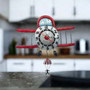 Allen Designs Airplane Jumper Pendulum Clock: Whimsical Antique Red Plane with Parachuting Passenger