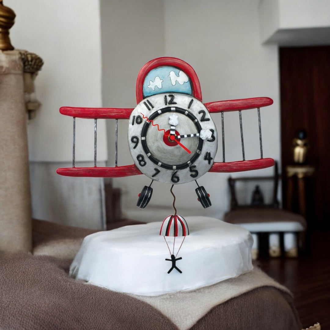 Allen Designs Airplane Jumper Pendulum Clock: Whimsical Antique Red Plane with Parachuting Passenger