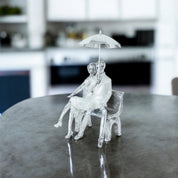 Romantic Moments Under the Umbrella - Couple on Bench Sculpture