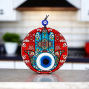 Round Glass Hamsa and Eye Design Surrounded by Vibrant Red, Protection, Cultural Decor, Housewarming Gift