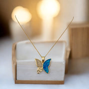 Butterfly Elegance: 18K Gold-Plated Pearl & Zircon Pendant with Blue Accents