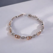 Diamond, Sterling Silver Bracelet with Silver and Gold Hues, Double Heart and Swirl Design,