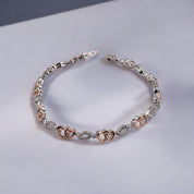 Diamond, Sterling Silver Bracelet with Silver and Gold Hues, Double Heart and Swirl Design,