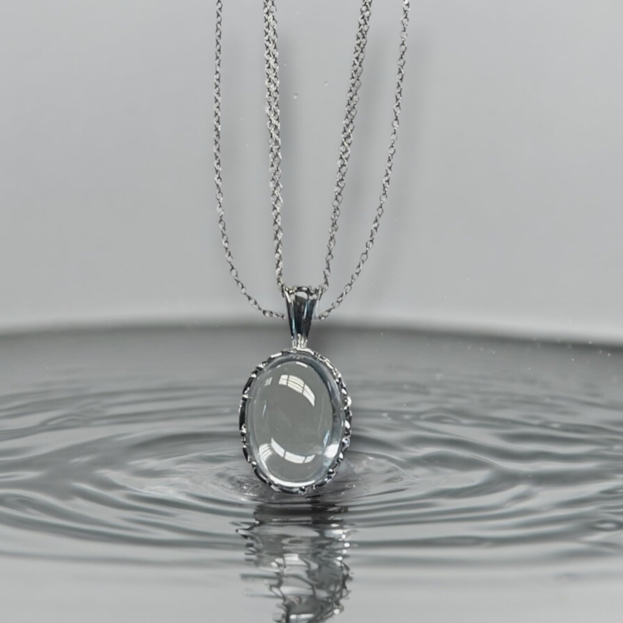 Exquisite Sterling Silver Oval Pendant Necklace with Crystal Embellishments, Featuring Three Chains for Enhanced Elegance and Versatility.