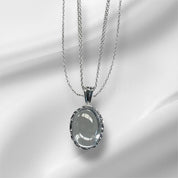 Exquisite Sterling Silver Oval Pendant Necklace with Crystal Embellishments, Featuring Three Chains for Enhanced Elegance and Versatility.