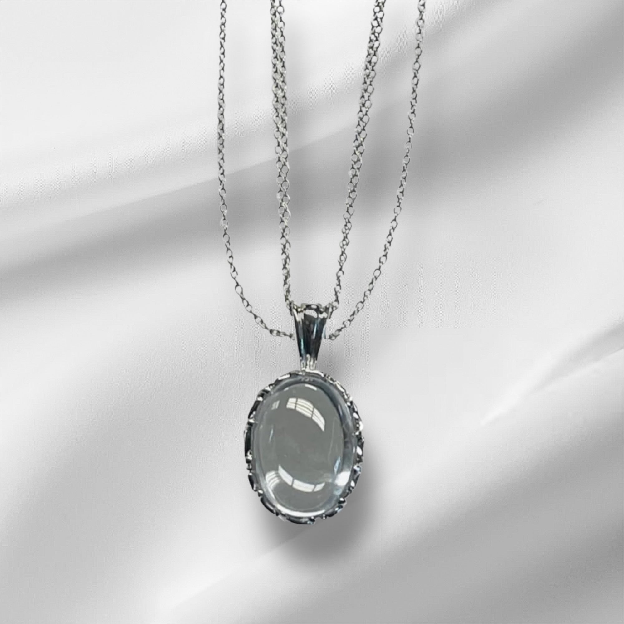 Exquisite Sterling Silver Oval Pendant Necklace with Crystal Embellishments, Featuring Three Chains for Enhanced Elegance and Versatility.